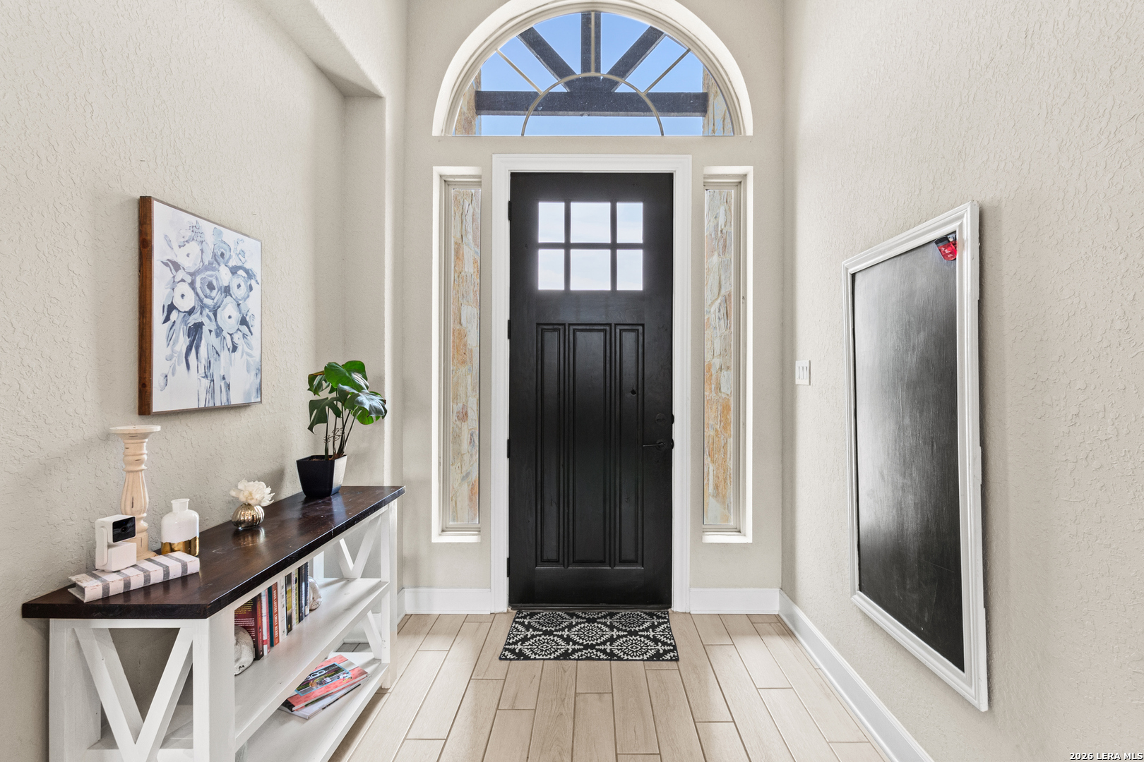 527 James Way Castroville, TX 78009 - Photo 4 of 32 a view of a hallway view with wooden floor and staircase