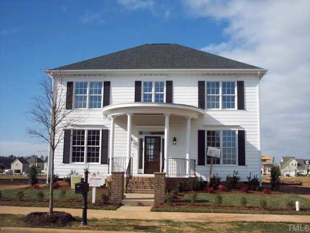 1328 Ileagnes Road Raleigh, NC 27603 - Photo 1 of 12 a front view of a house with garden