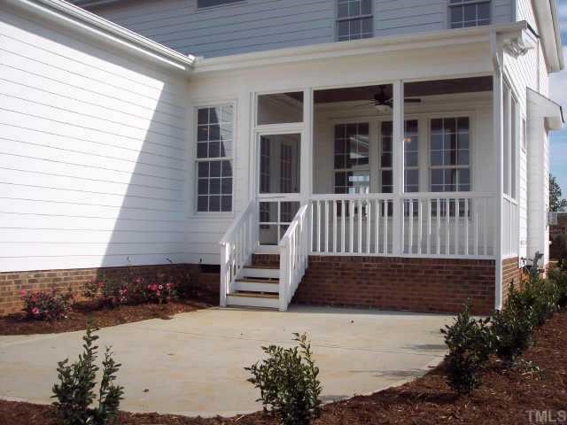 1328 Ileagnes Road Raleigh, NC 27603 - Photo 12 of 12 a view of a house with wooden fence next to a yard