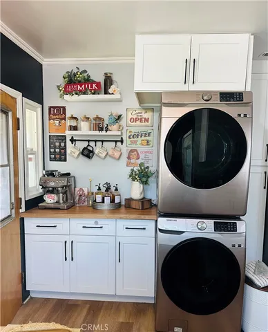 a utility room with sink dryer and washer