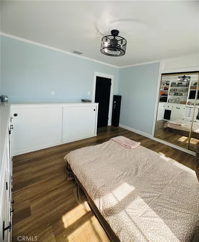 a bedroom with a bed and furniture