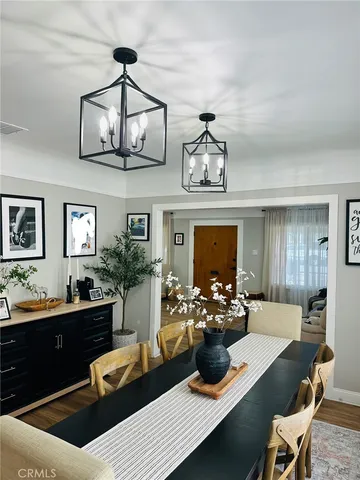 a bedroom with furniture and wooden floor