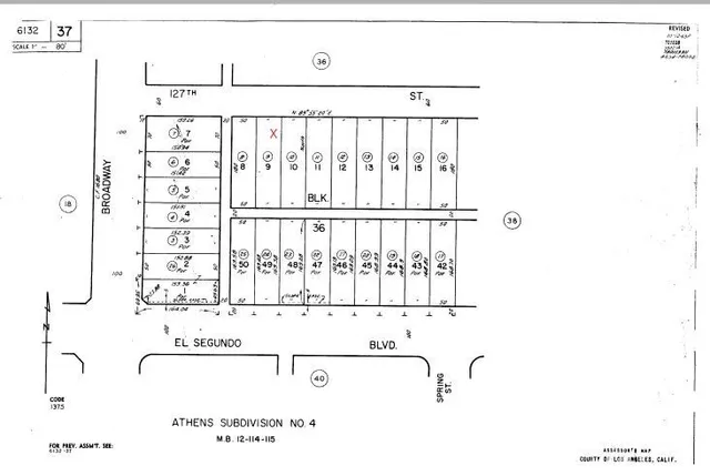 a bedroom with a bed and a flat tv screen on the dresser
