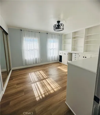 a view of a room with a wooden floor