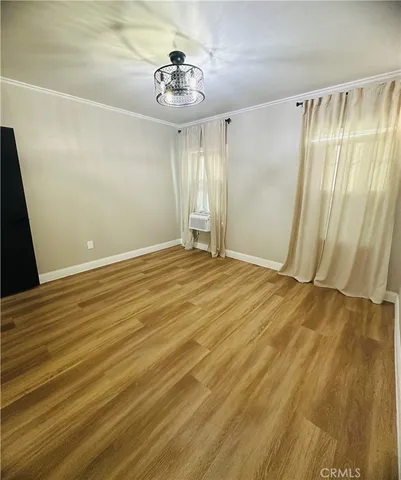 a kitchen with a sink a stove and cabinets