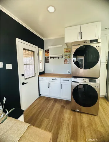 a kitchen with a refrigerator and a stove top oven