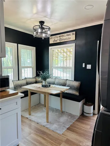 a view of a livingroom with workspace and a window