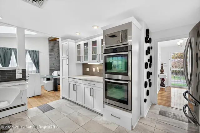 a bathroom with a toilet and a shower curtain