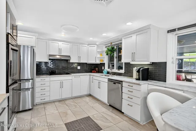 a bedroom with a bed and flat screen tv