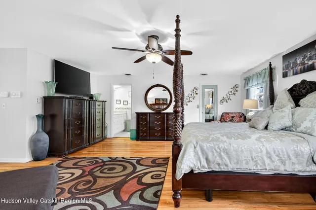 a living room with furniture a flat screen tv and a couch