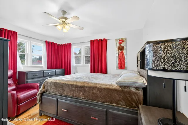 a large bathroom with a granite countertop double vanity sink a mirror and shower