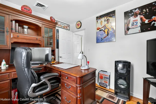 a room with furniture and flat screen tv