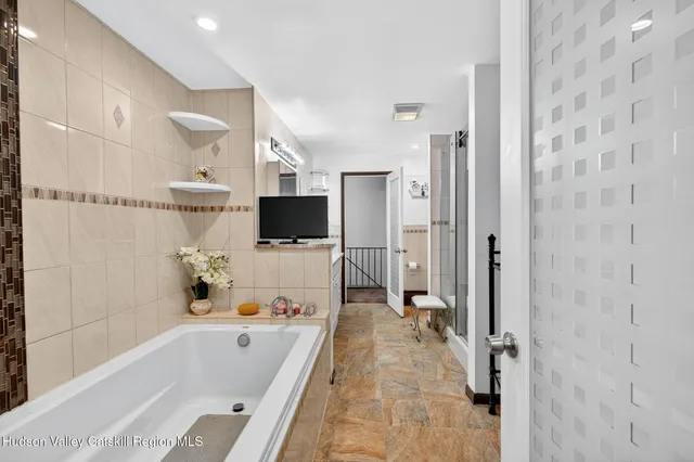 a living room with furniture and a flat screen tv