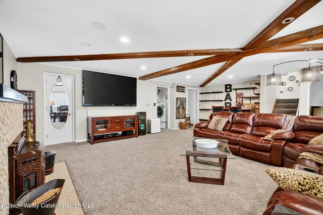 a front view of a house with a yard table and chairs
