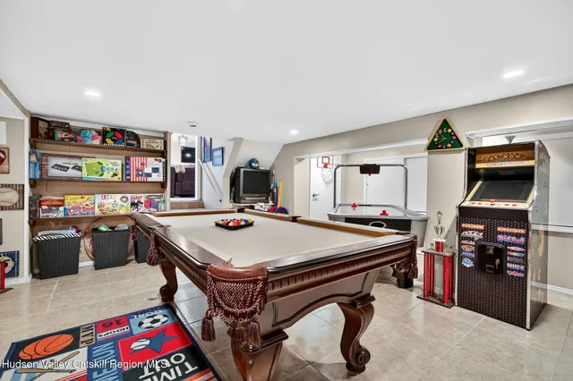 a view of a patio with a dining table and chairs under an umbrella
