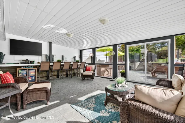 a aerial view of a house with swimming pool and a yard