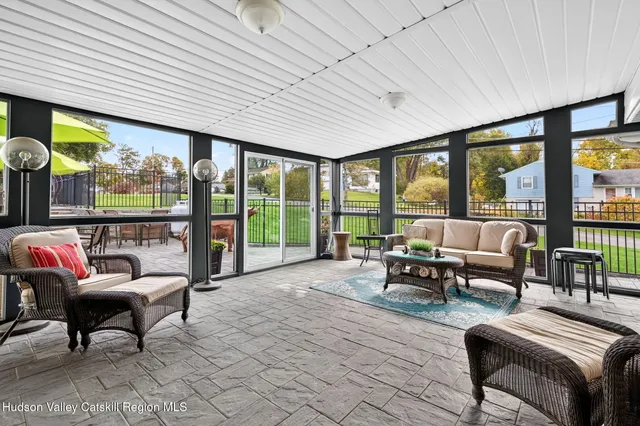 an aerial view of a house with a garden and swimming pool