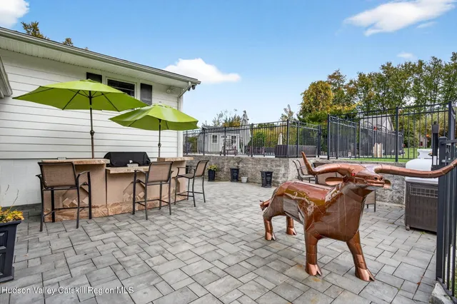 an aerial view of lake and residential houses with outdoor space