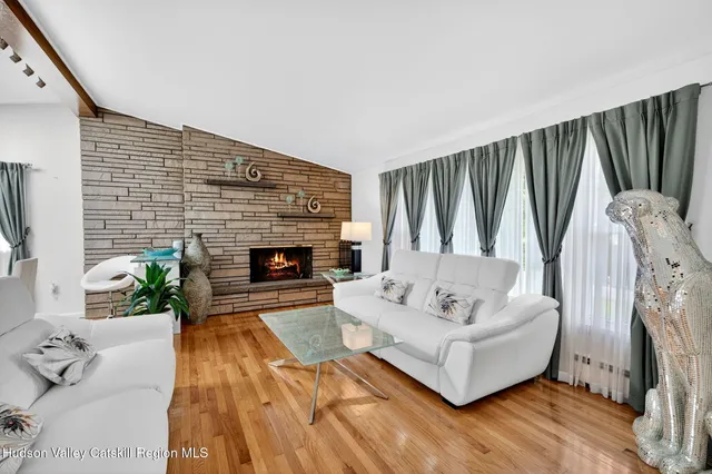 a view of a livingroom with furniture and window