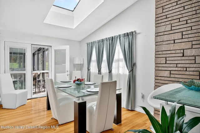 a kitchen with white cabinets and appliances