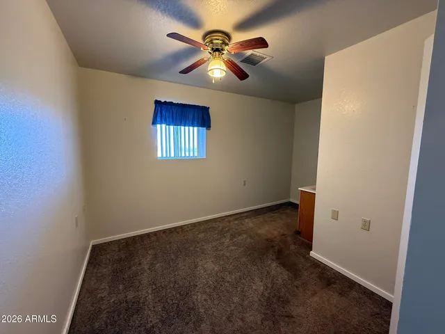 a room with a sink a mirror and a shower