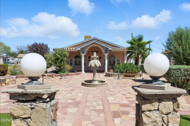 a view of a workspace with furniture and a chandelier
