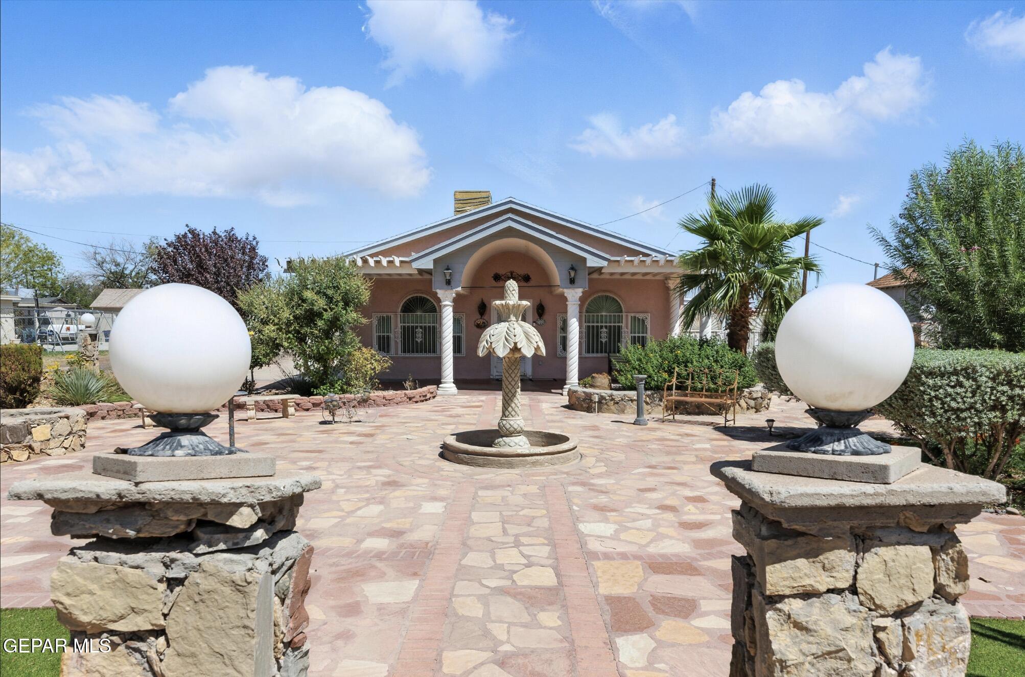 a view of a workspace with furniture and a chandelier