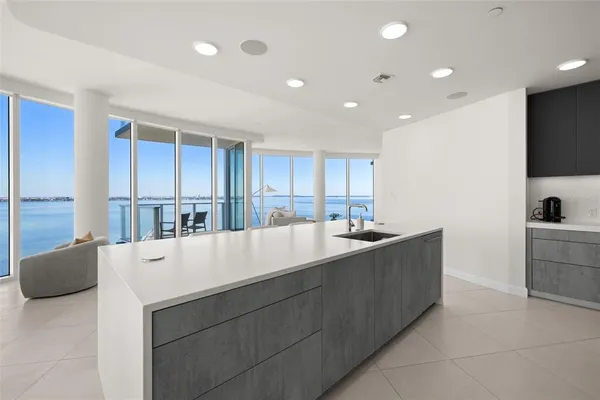 a kitchen that has a sink and a stove