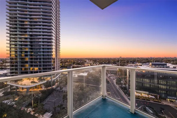 a bathroom with a sink a toilet a mirror and shower