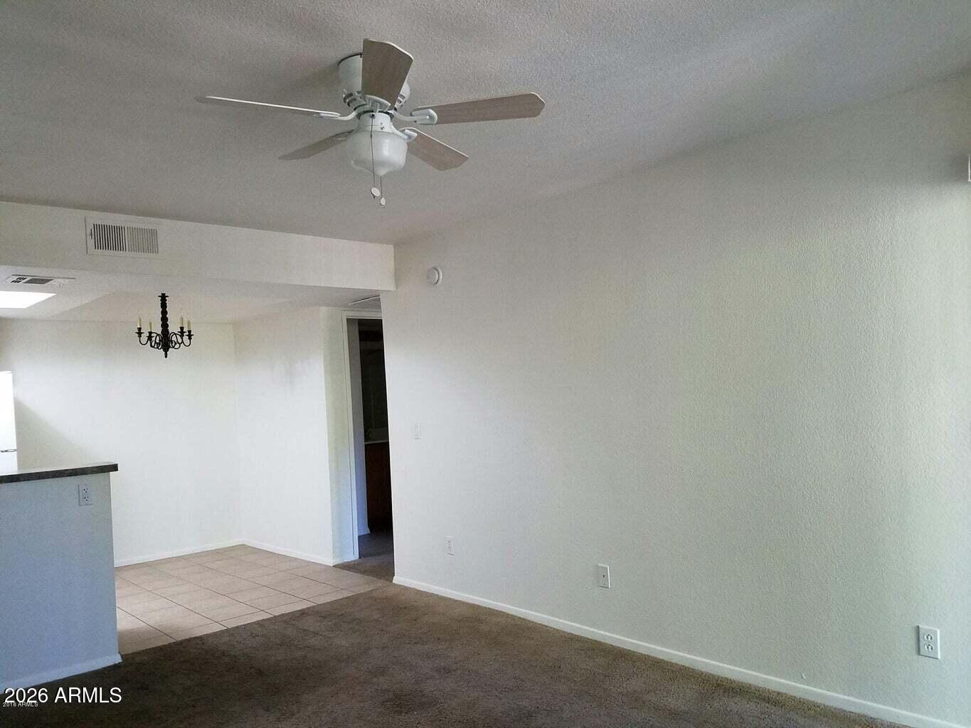 1720 East Thunderbird Road, Unit 2100 Phoenix, AZ 85022 - Photo 2 of 9 an empty room with closet and fan