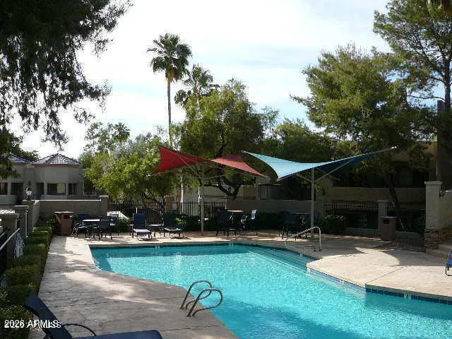 a view of a swimming pool with a patio