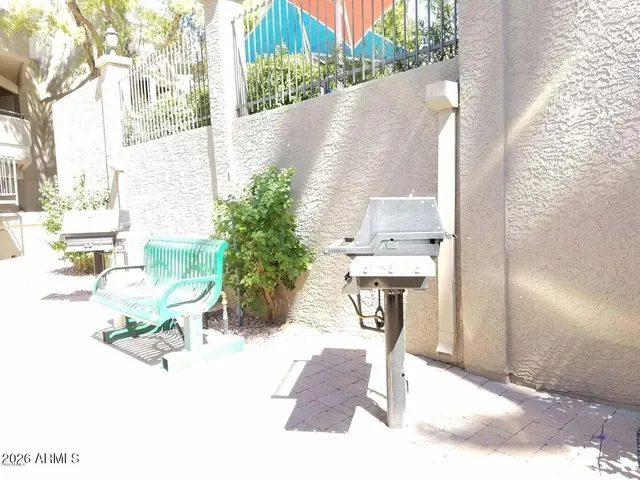 a swimming pool with outdoor seating and yard