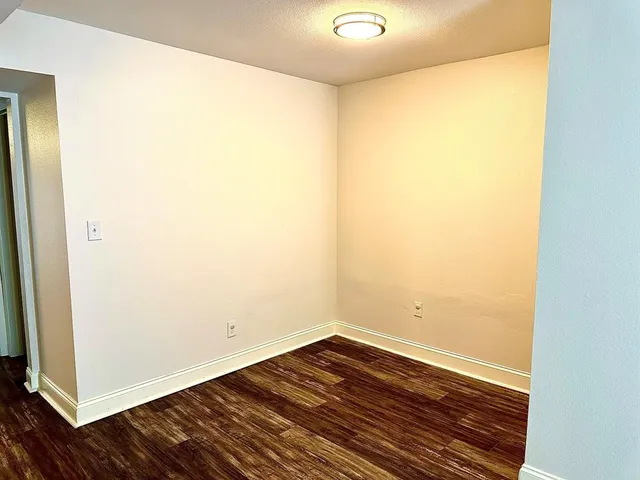 a view of a small space with wooden floor