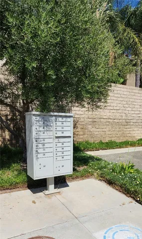 a view of a wooden fence and a yard