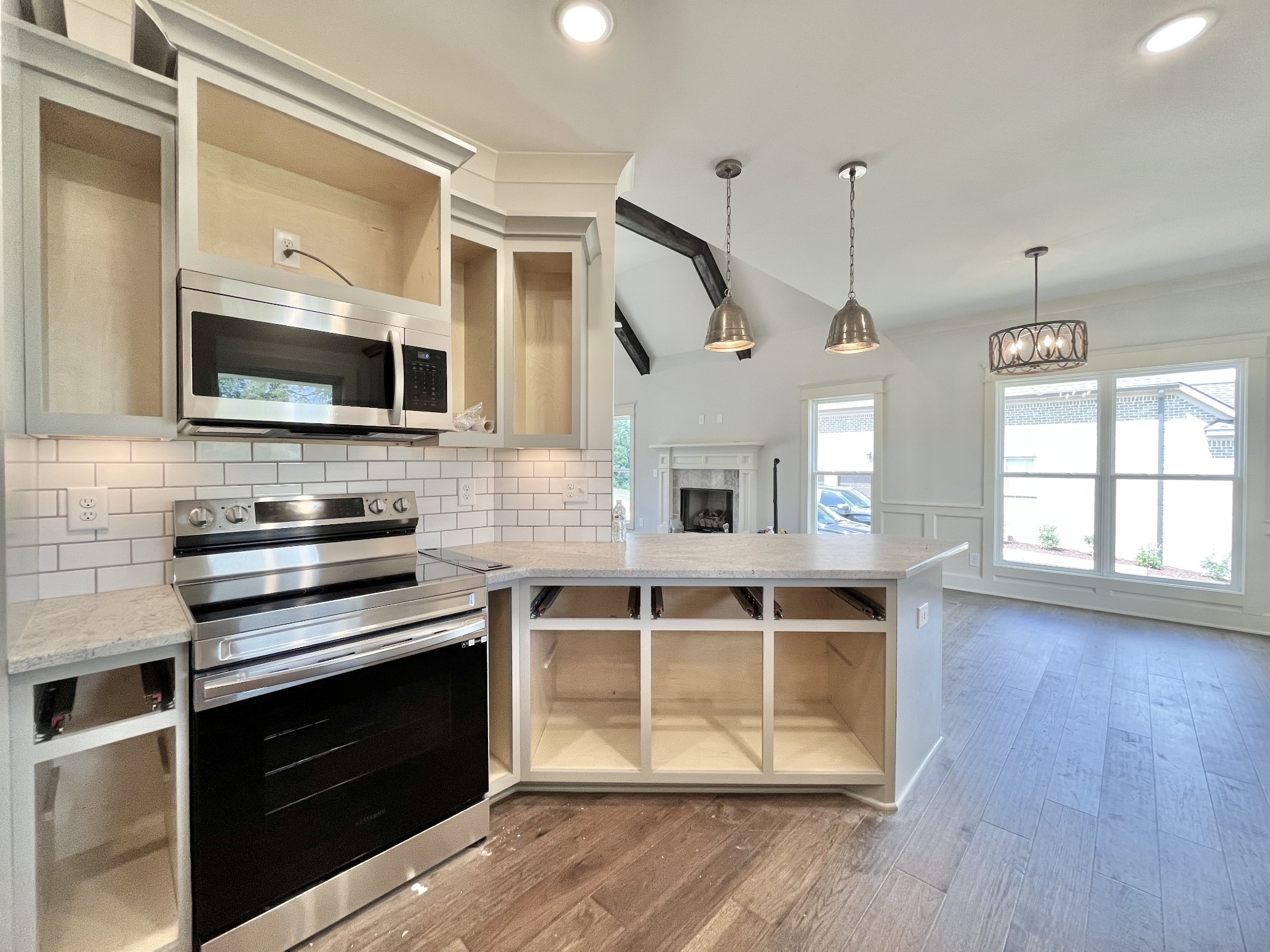 813 Ridgestone Place, Unit 99 Lebanon, TN 37087 - Photo 11 of 24 a kitchen with stainless steel appliances a stove and a microwave