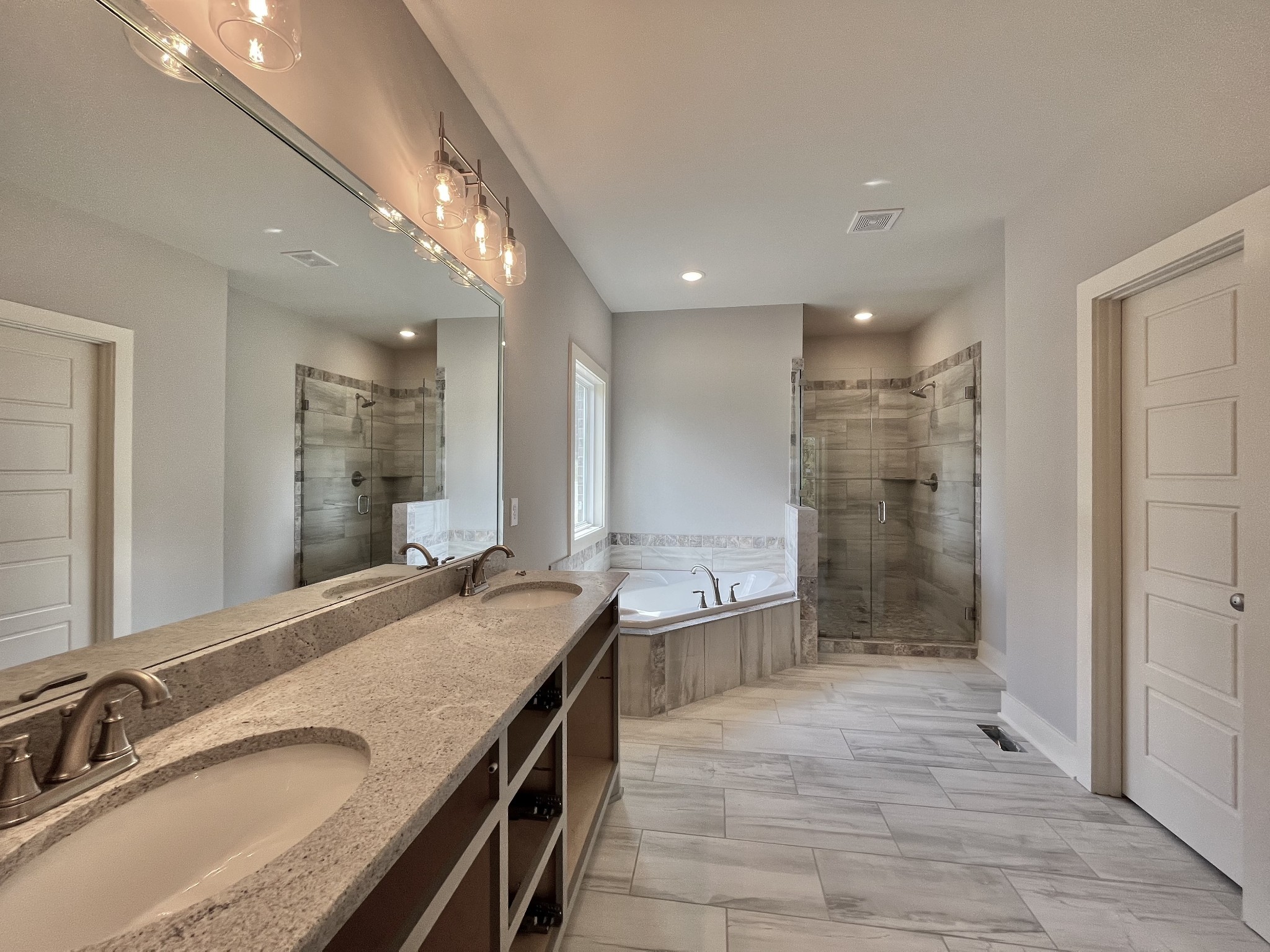 813 Ridgestone Place, Unit 99 Lebanon, TN 37087 - Photo 18 of 24 a bathroom with a granite countertop sink mirror and shower