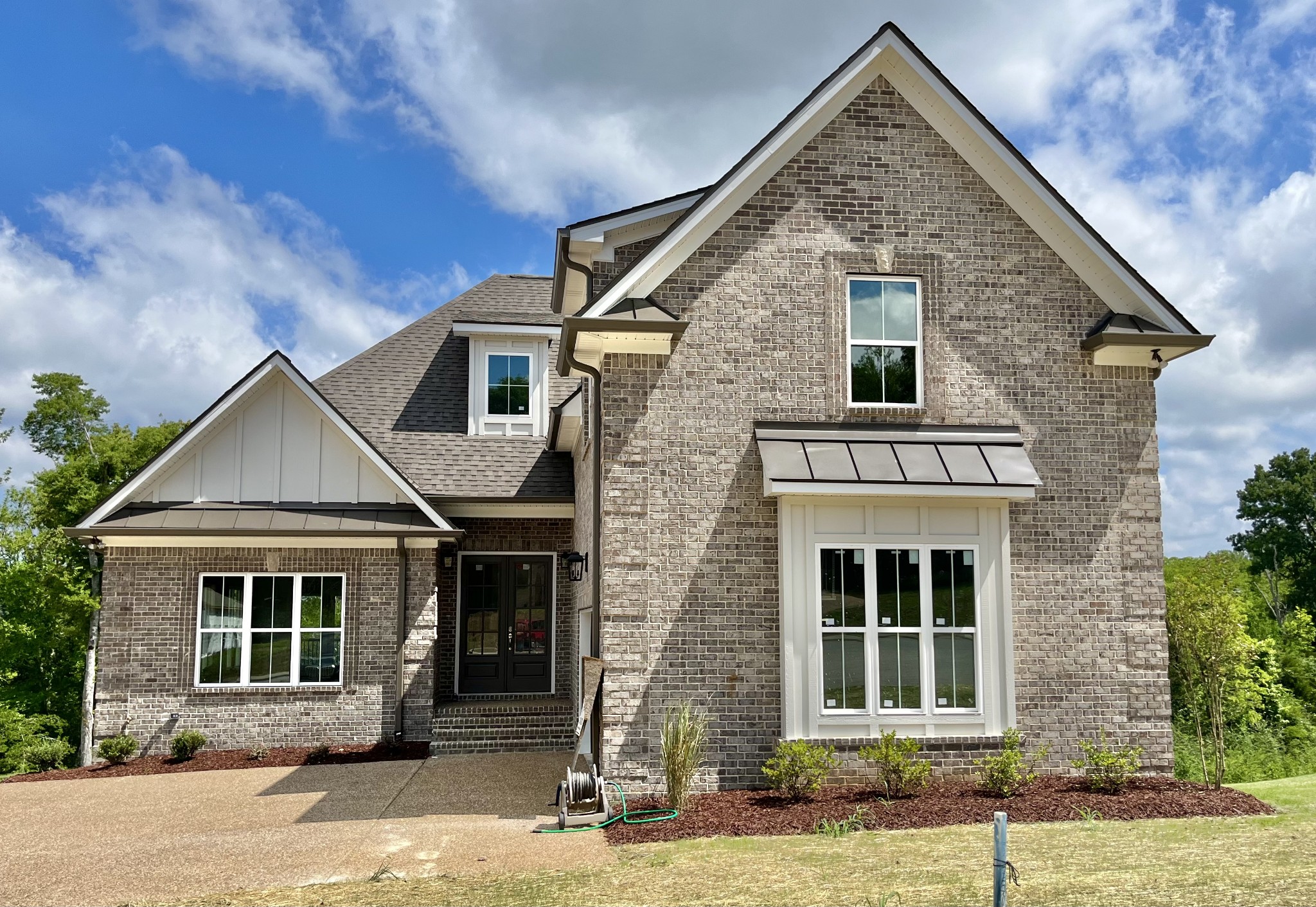 813 Ridgestone Place, Unit 99 Lebanon, TN 37087 - Photo 2 of 24 a front view of a house with a yard