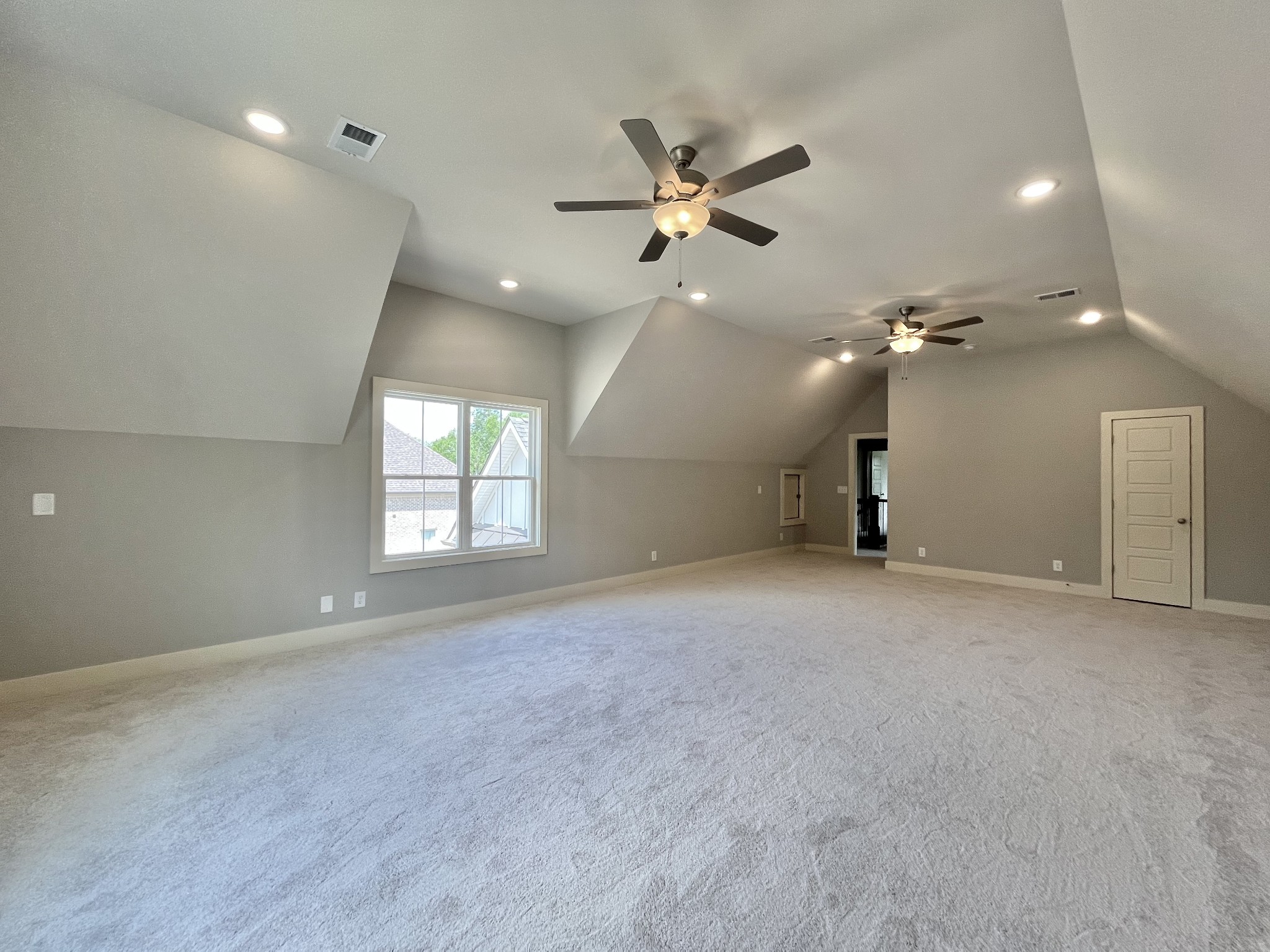 813 Ridgestone Place, Unit 99 Lebanon, TN 37087 - Photo 21 of 24 an empty room with a ceiling fan and window