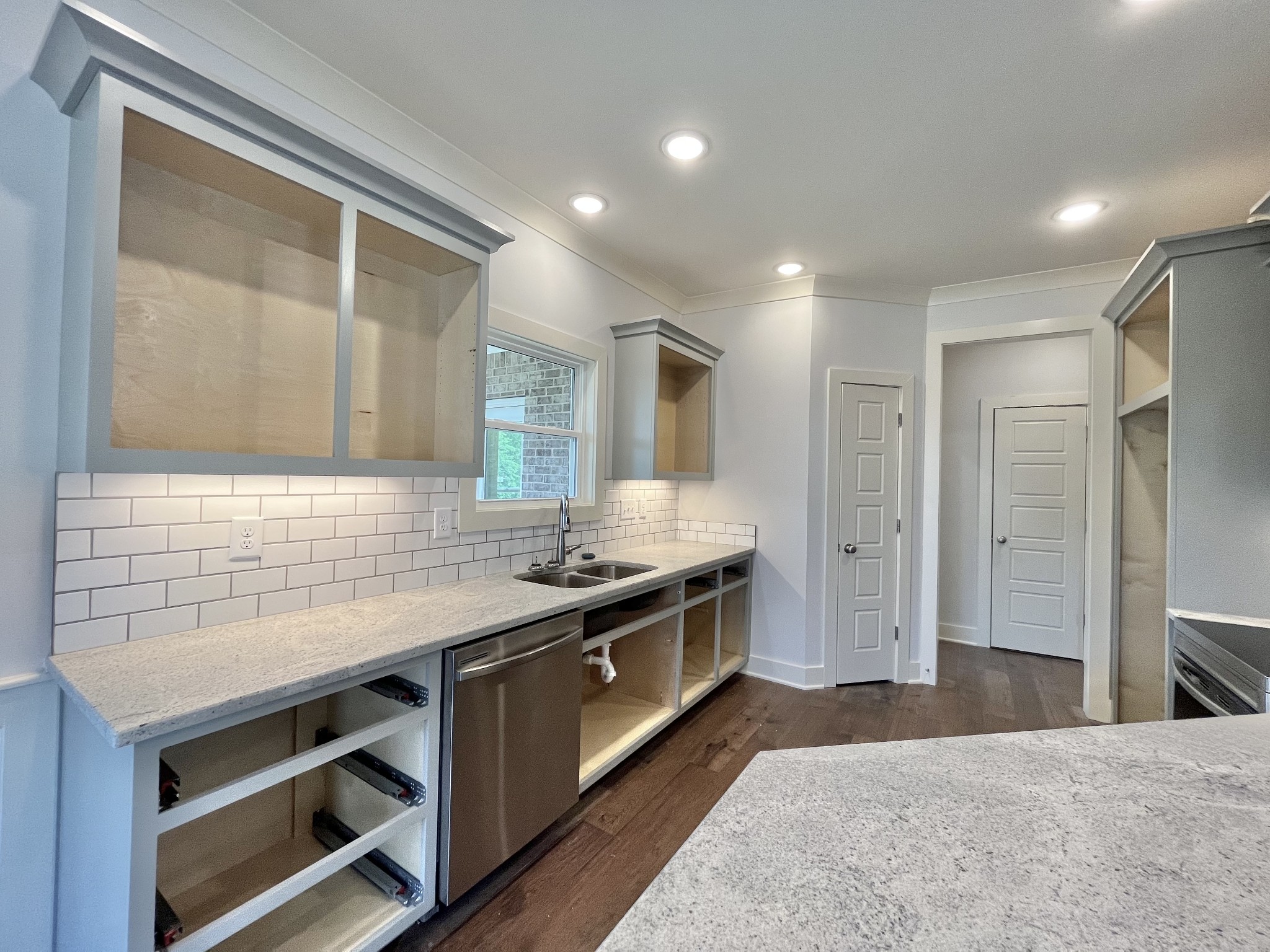 813 Ridgestone Place, Unit 99 Lebanon, TN 37087 - Photo 9 of 24 a kitchen with a stove and a sink