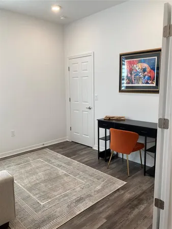 a workspace with furniture and wooden floor