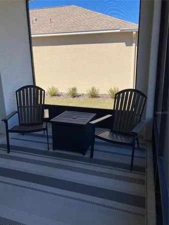 a view of balcony with furniture