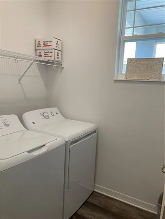 a utility room with dryer and washer