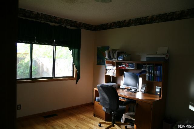 4490 Persimmon Road Reno, NV 89502 - Photo 5 of 6 a view of workspace with wooden floor windows