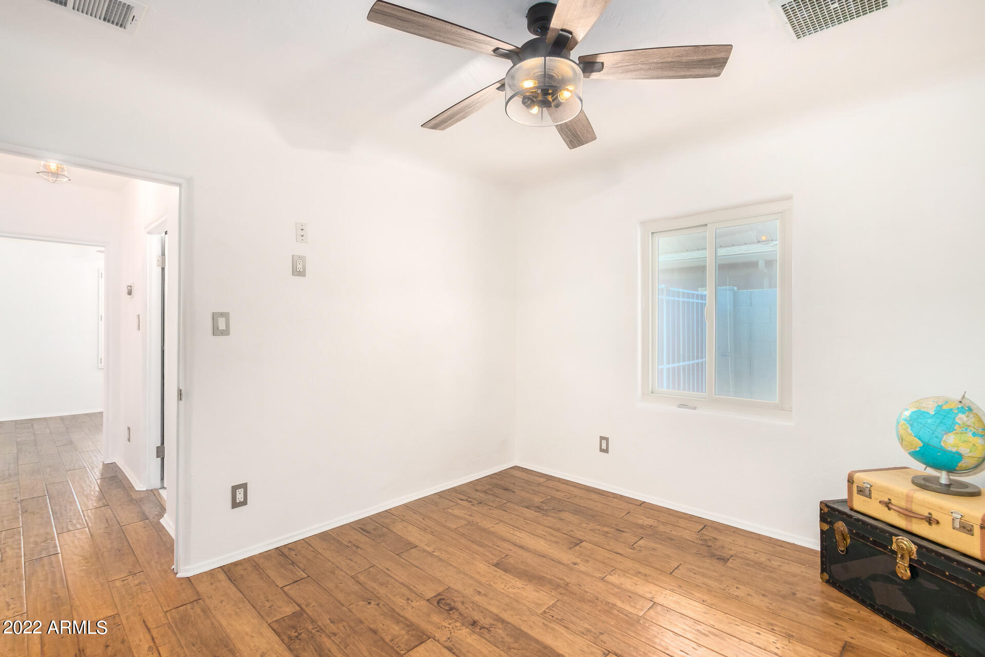 1330 East Granada Road Phoenix, AZ 85006 - Photo 15 of 24 a view of empty room with wooden floor