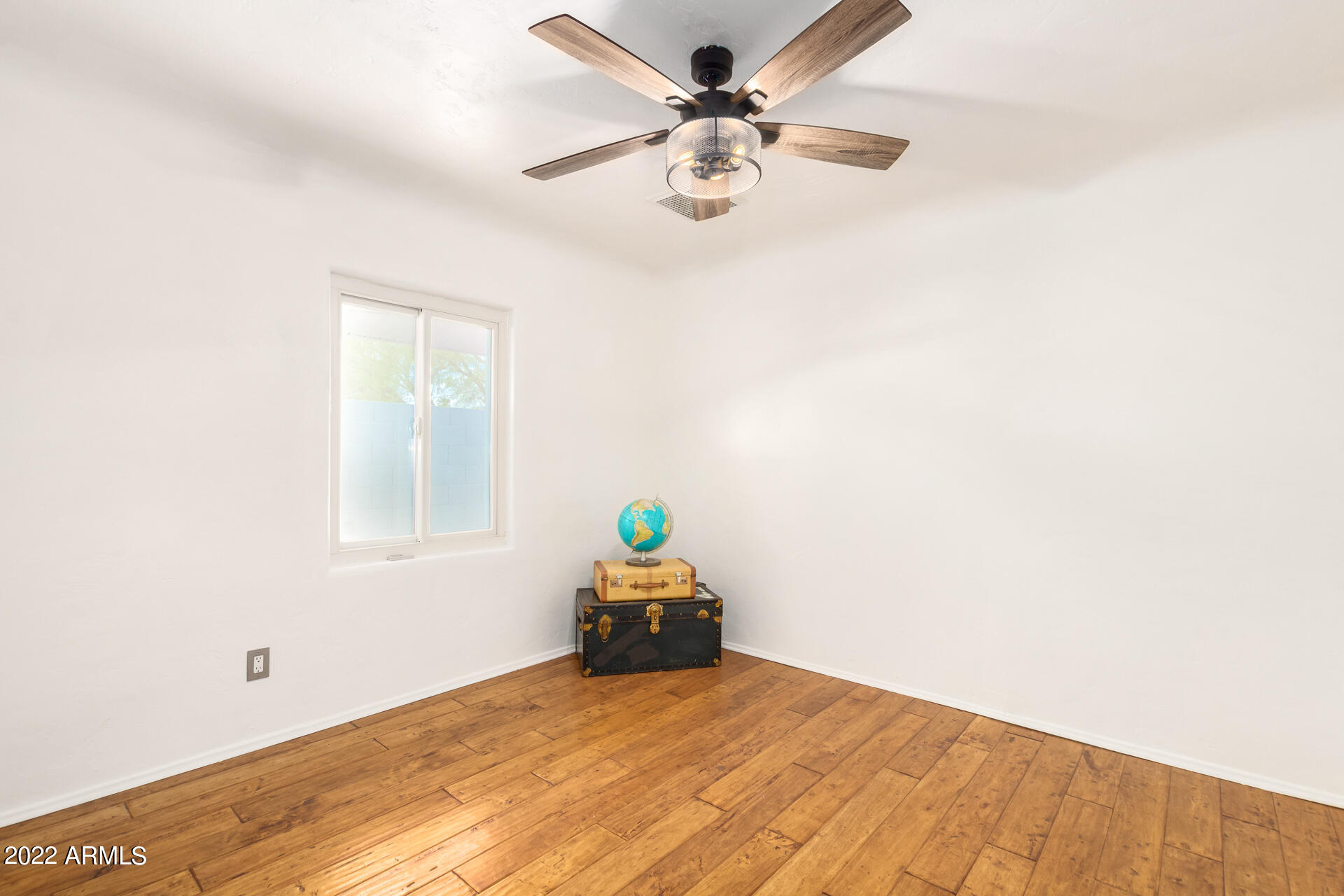 1330 East Granada Road Phoenix, AZ 85006 - Photo 16 of 24 a bedroom with a bed and a chandelier