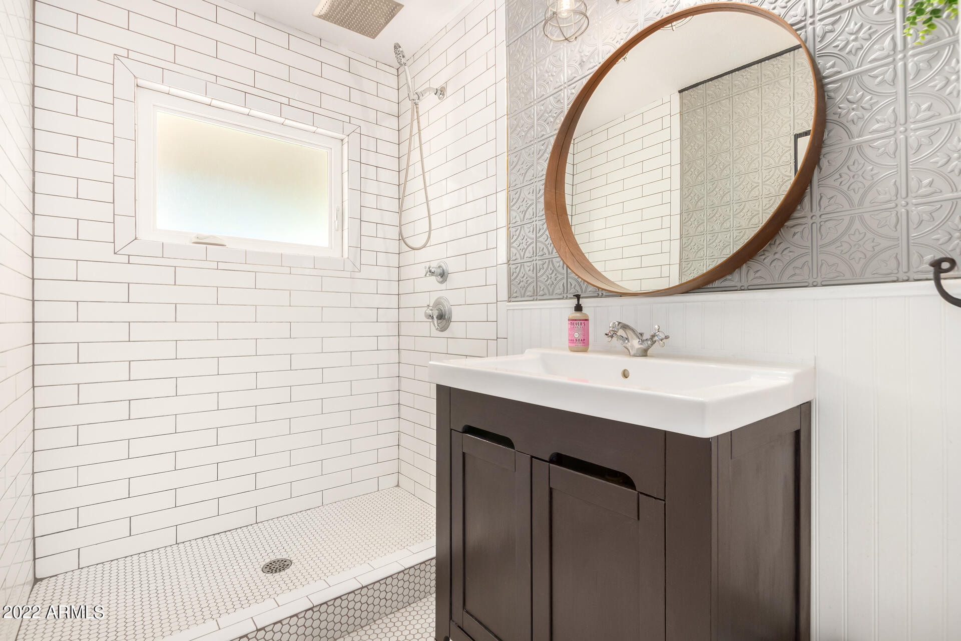 1330 East Granada Road Phoenix, AZ 85006 - Photo 17 of 24 a bathroom with a sink a mirror and a shower