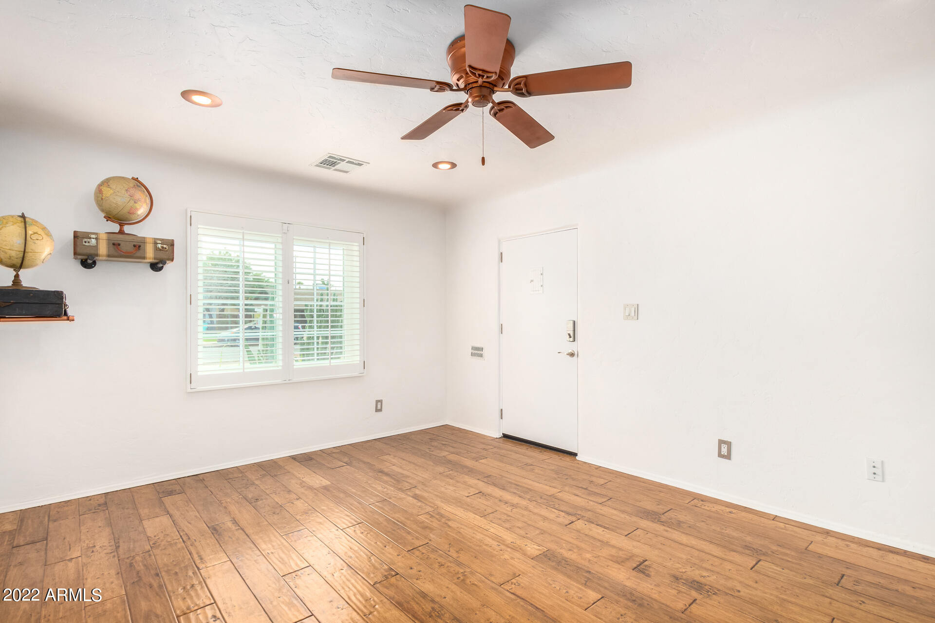 1330 East Granada Road Phoenix, AZ 85006 - Photo 4 of 24 a view of empty room with wooden floor