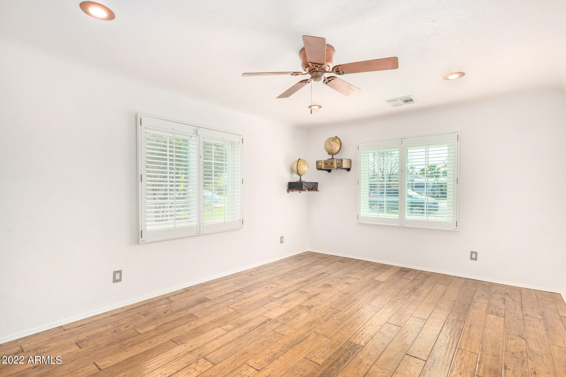 1330 East Granada Road Phoenix, AZ 85006 - Photo 5 of 24 a view of empty room with wooden floor and fan