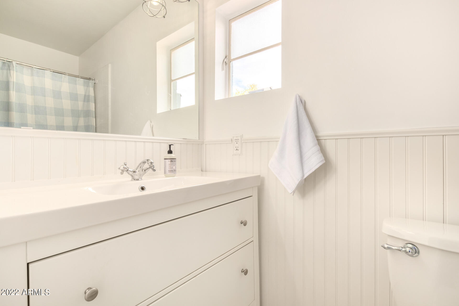 1330 East Granada Road Phoenix, AZ 85006 - Photo 10 of 24 a bathroom with a sink and a large mirror