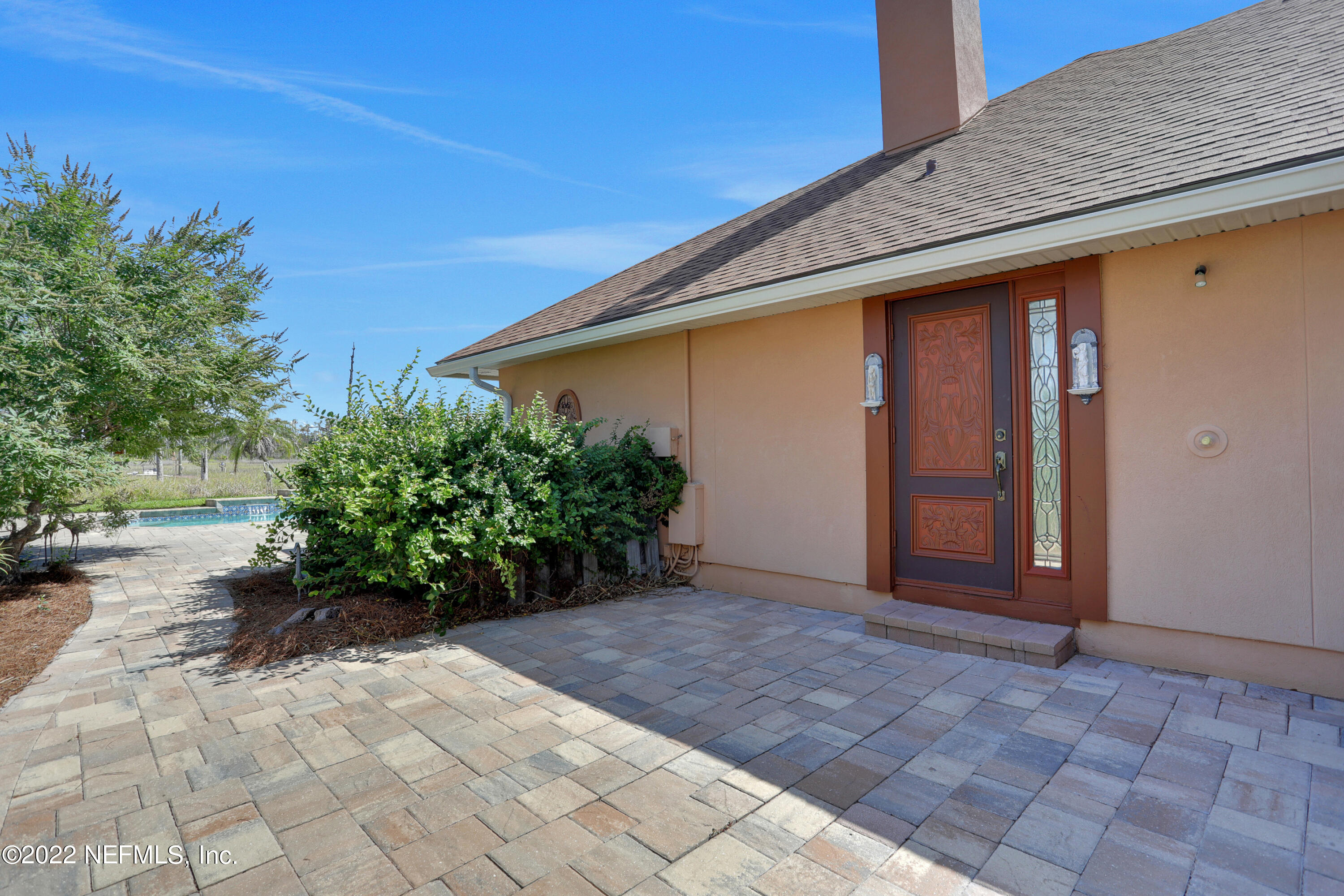1773 Marshside Drive Jacksonville Beach, FL 32250 - Photo 61 of 66 Outdoor shower and door from 1/2 bath